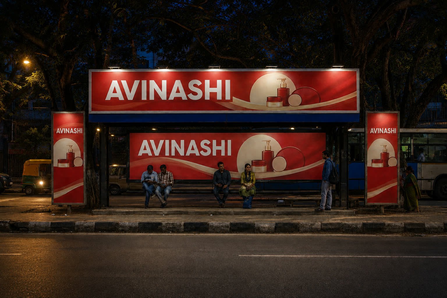 The same Bengaluru bus shelter with illuminated advertising at night