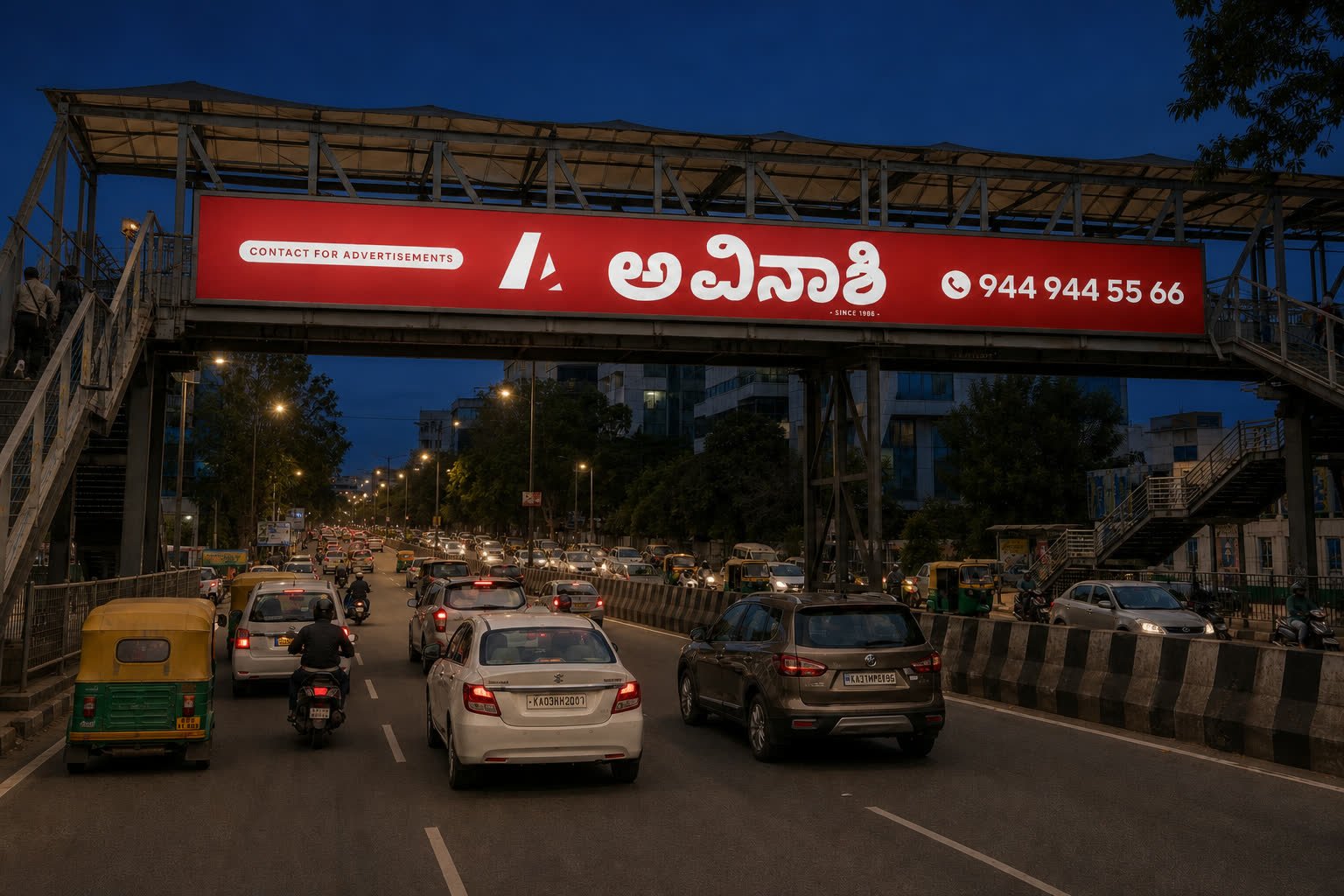 Illuminated Avinashi Ads skywalk advertising at night