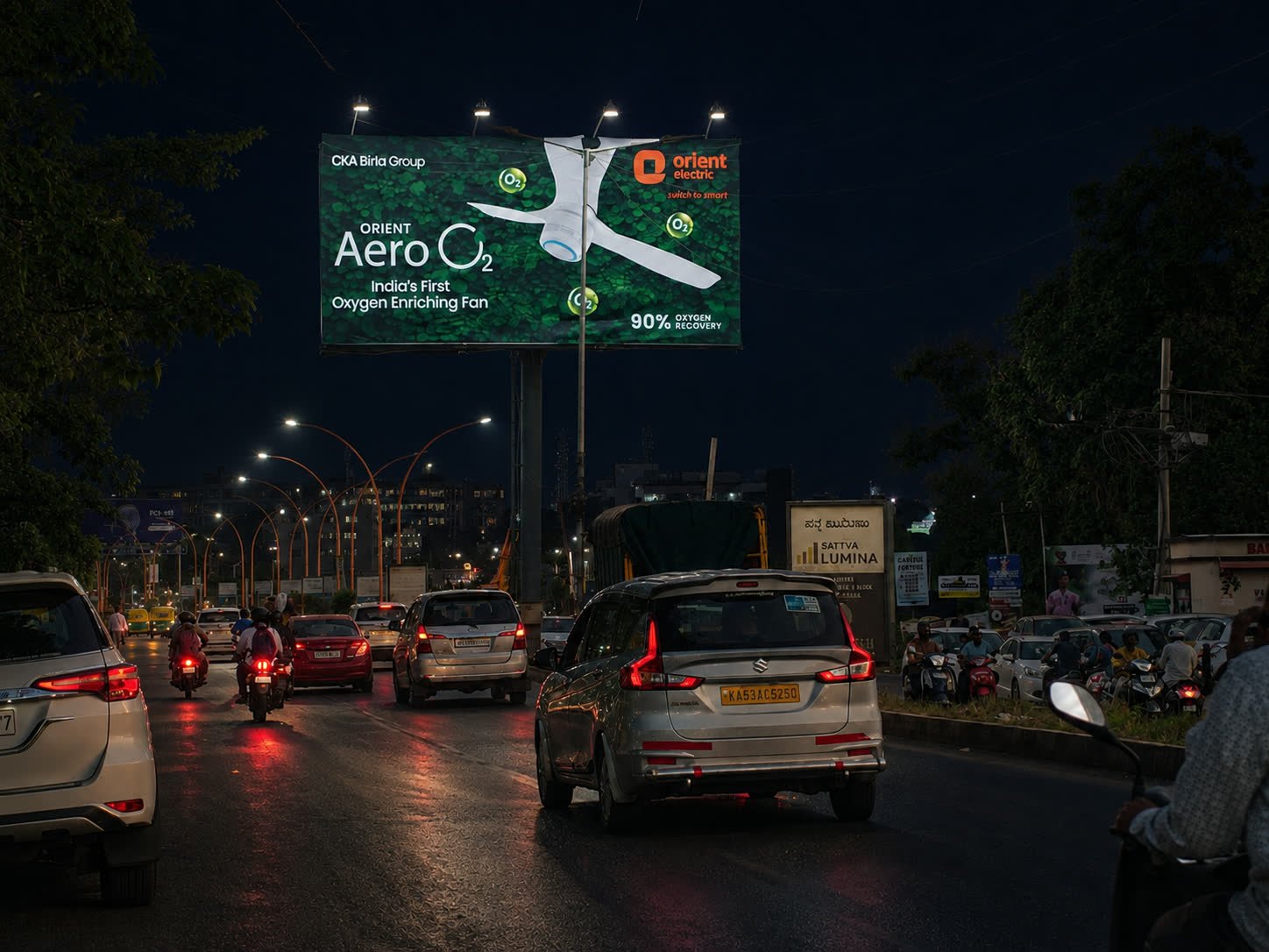 Illuminated unipole opposite Yelahanka Godrej Avenues toward BMSIT at night