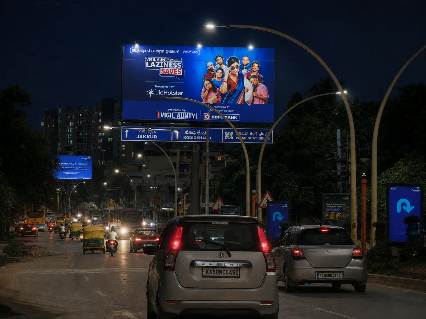 Illuminated unipole opposite Yelahanka Puttenahalli Bus Depot at night