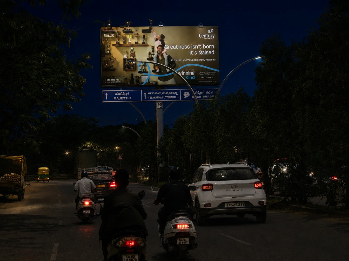 Illuminated unipole opposite Ramanashree Resort toward Dairy Circle at night